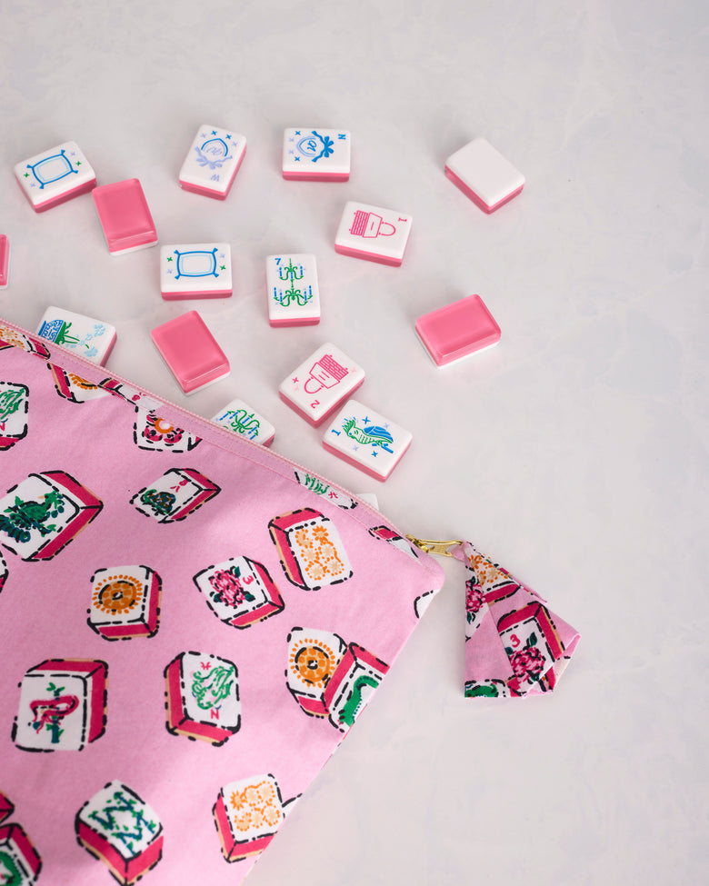 Close view of the Lucky Tiles pouch print, zipper, and matching pull tab beside Mah Jongg tiles