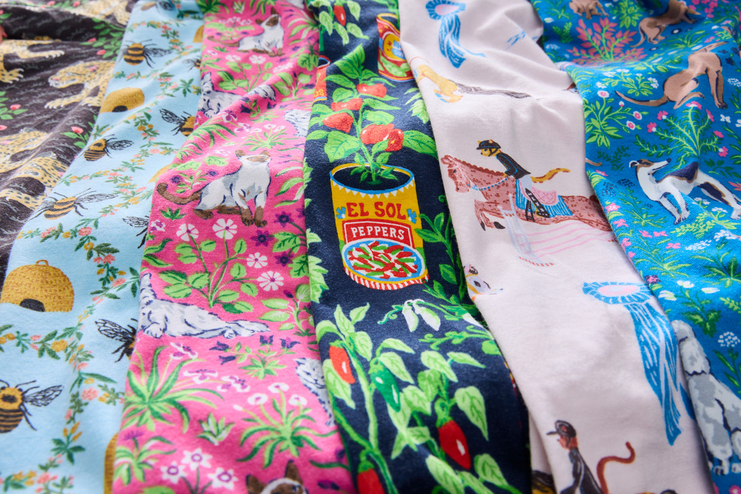 Colorful patterned pajama fabrics displayed side by side. 