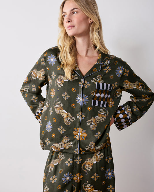 Front view of the olive Bagheera Kaleidoscope Rittenhouse set, showing a long-sleeved button-front top with geometric-trimmed cuffs and pocket, paired with matching printed pants.