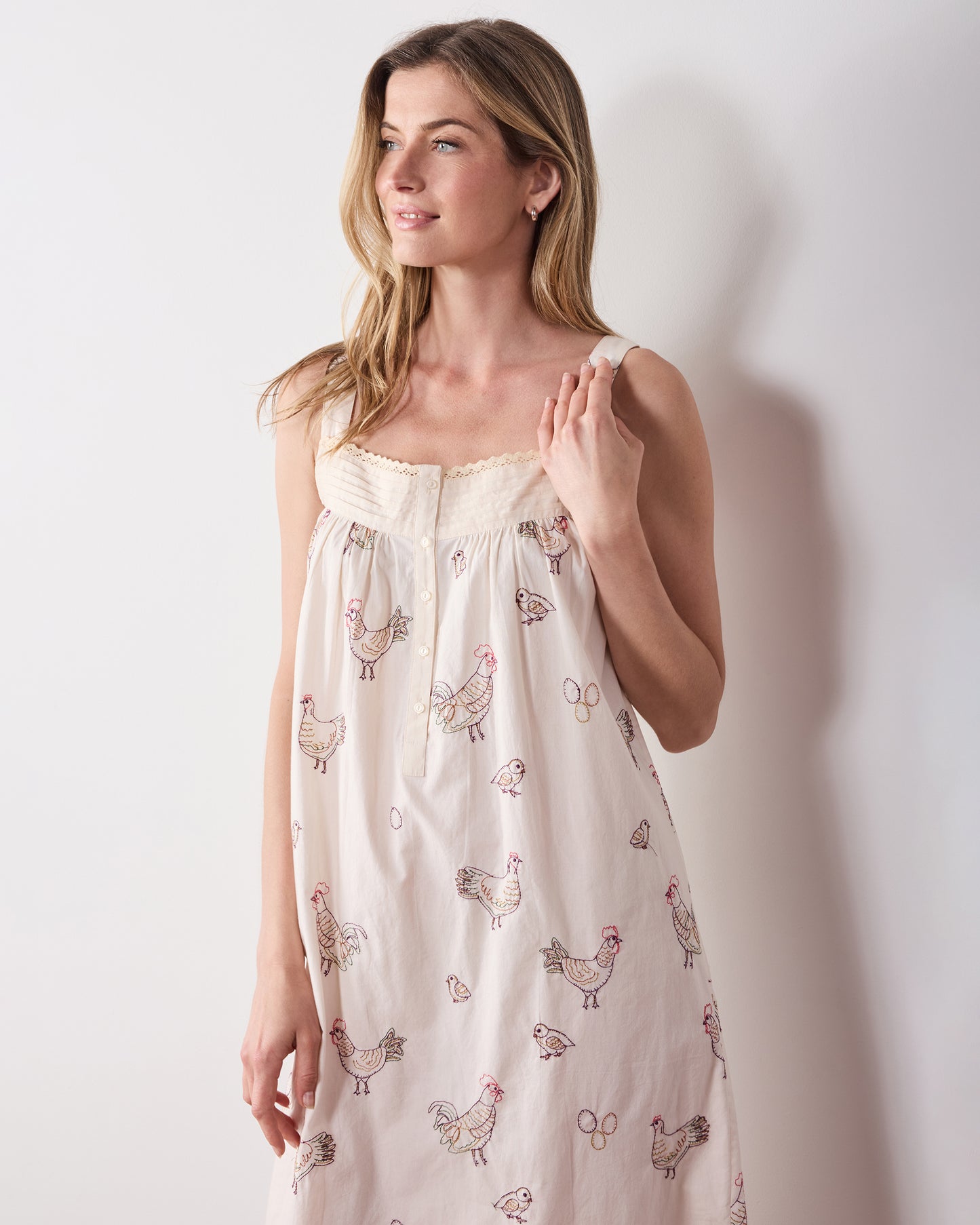 Front angled view of the buff embroidered-hen Back to Bed nightgown.