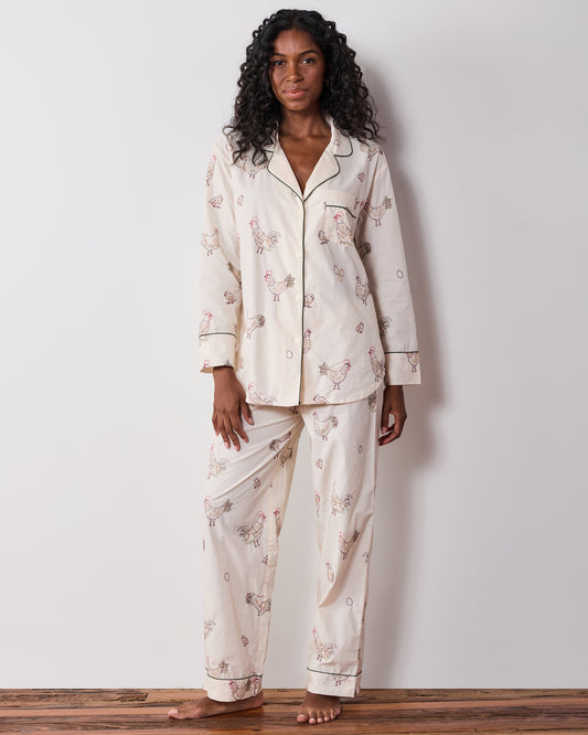 Front view of the long pajama set with a button-front top and matching full-length pants featuring embroidered hens.