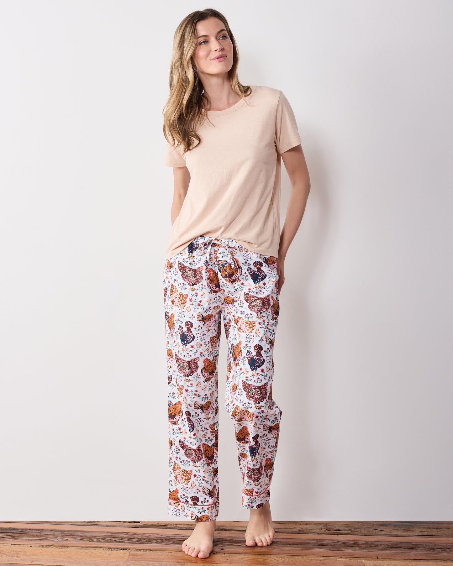 Three-quarter back view of printed pajama pants with a drawstring waist and straight legs.