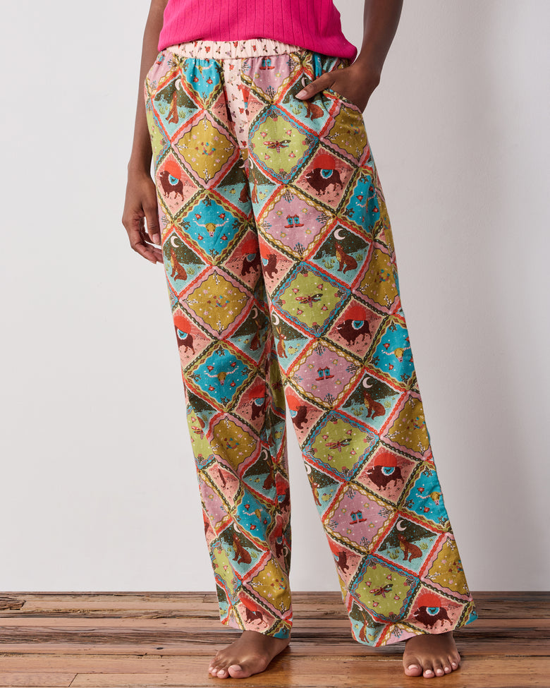 Front close-up of the Western Scenes wide-leg pajama pants, showing the relaxed legs, elastic waistband, and colorful diamond-patterned print.