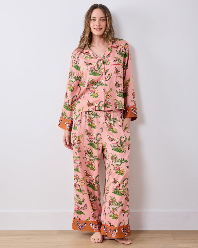Full-length front view of a model wearing the pink Butterfly Forager tall pajama set with a button-front top, chest pocket, and wide-leg pants.
