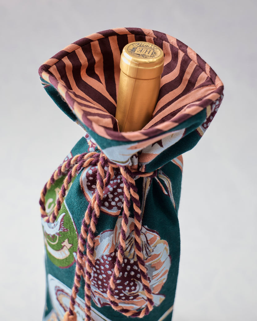 Open Champagne & Caviar wine bag displaying its striped lining and the top of a bottle inside.