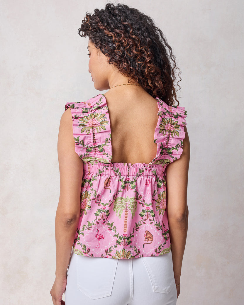Back view of pink tropical-print Maya top with wide ruffled straps and an elastic neckline