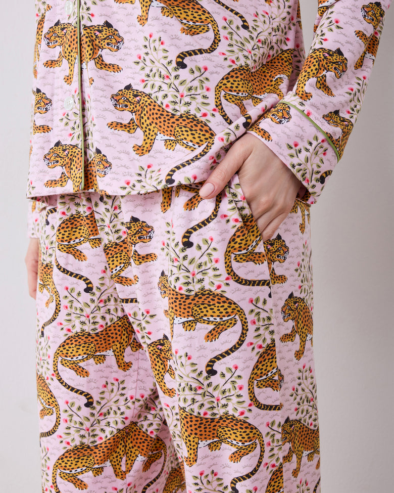 Close-up of the Bagheera blush long pajama set, showing the button-down top, pocket, pants, and leopard print.