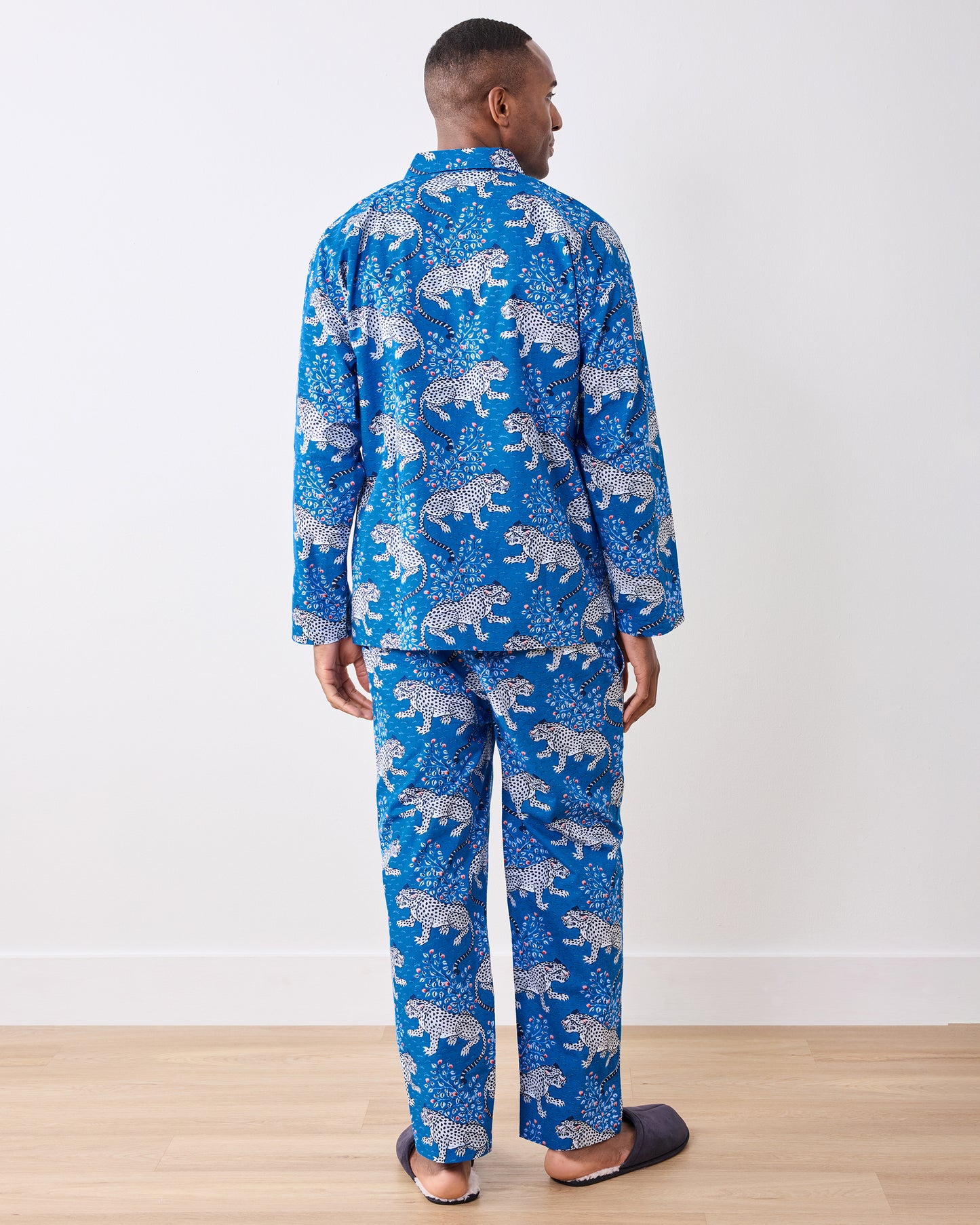 Full back view of the indigo long pajama set worn with slippers