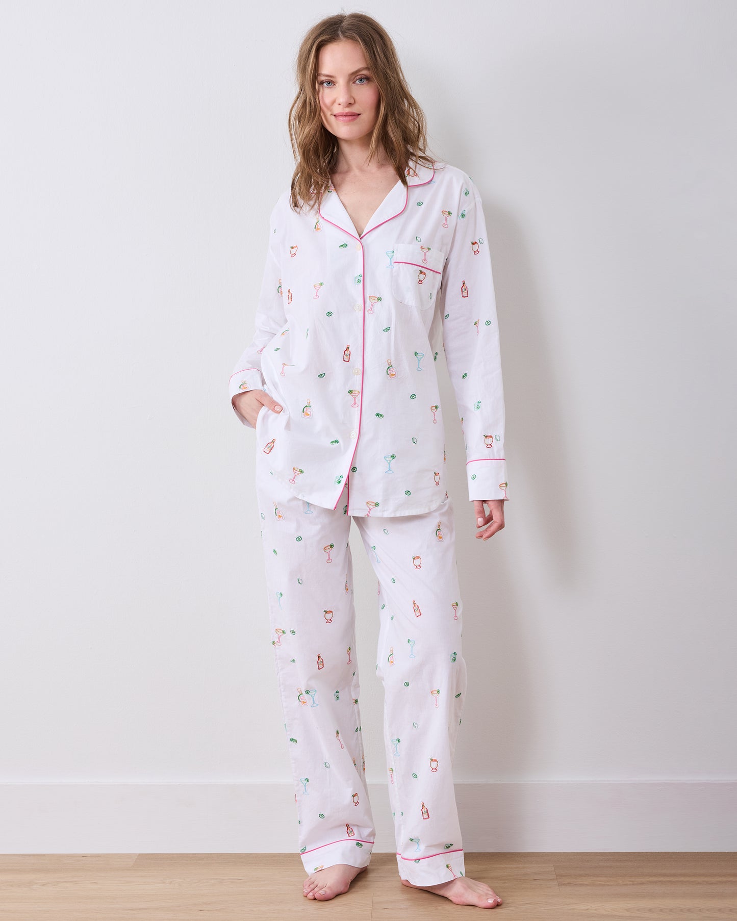 Front view of the Embroidered Tequila Sunrise long pajama set, with a button-front shirt and wide-leg pants covered in cocktail-themed embroidery.