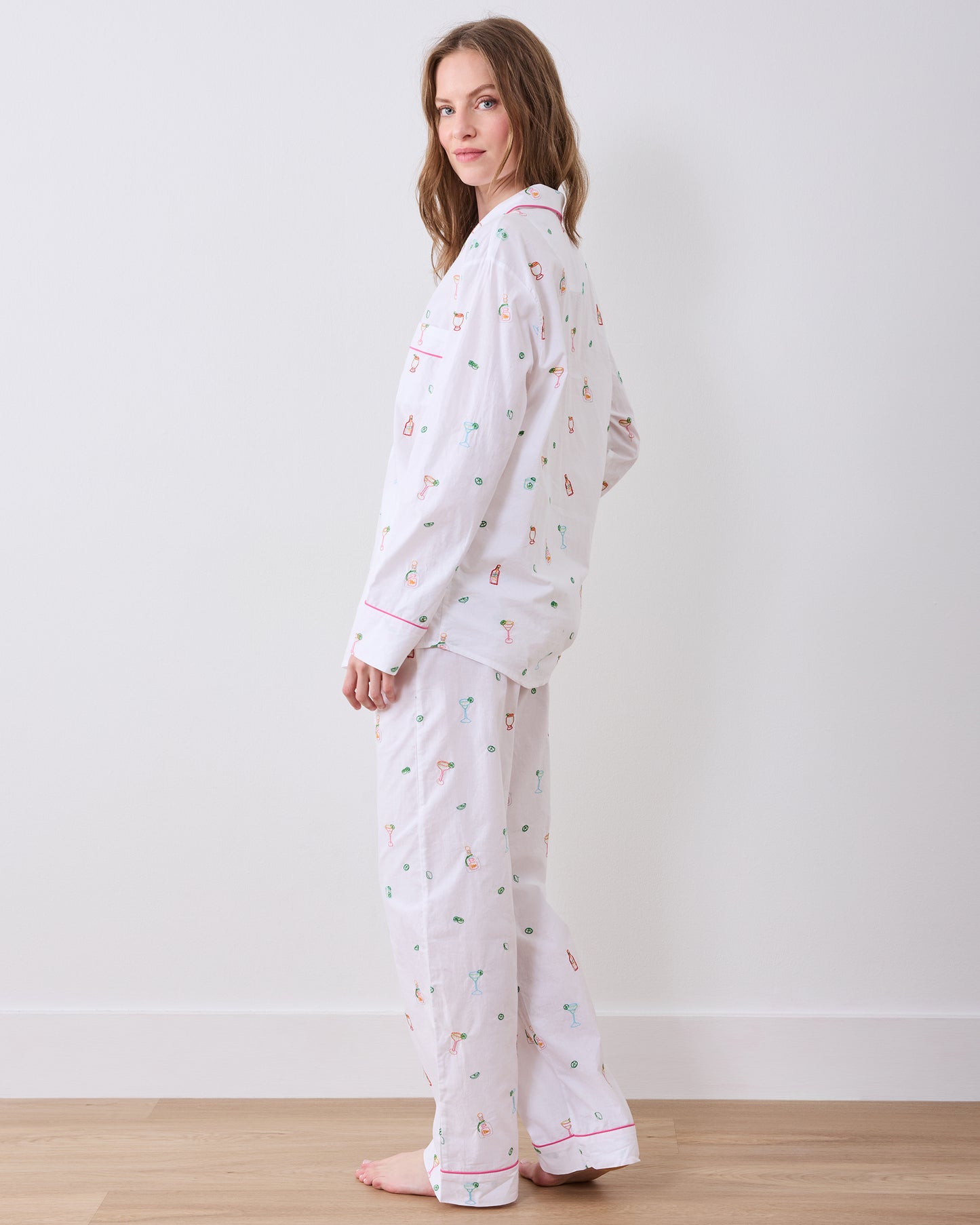 Side and back view of the Embroidered Tequila Sunrise long pajama set, showing the shirt and wide-leg pants from behind.