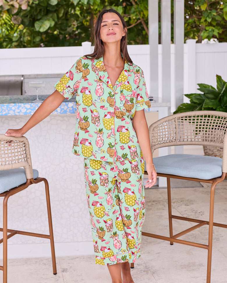 Full front view of the Mojito short-sleeve top and cropped pants set at an outdoor bar