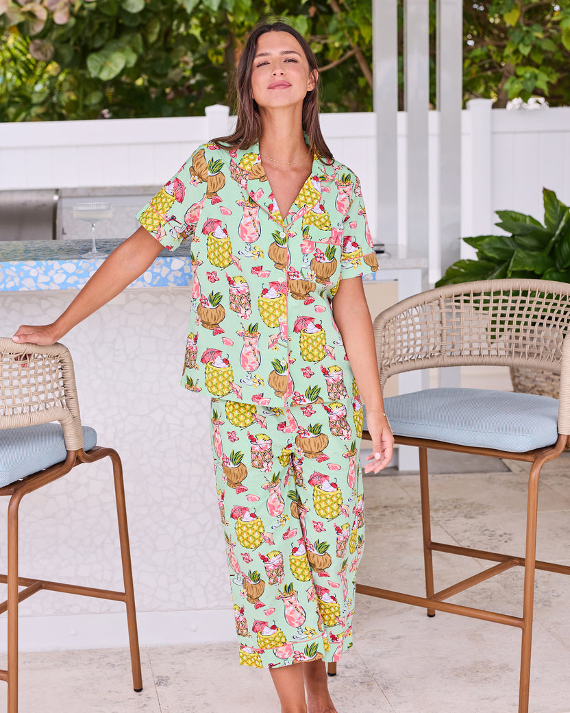 Full front view of the Mojito short-sleeve top and cropped pants set at an outdoor bar