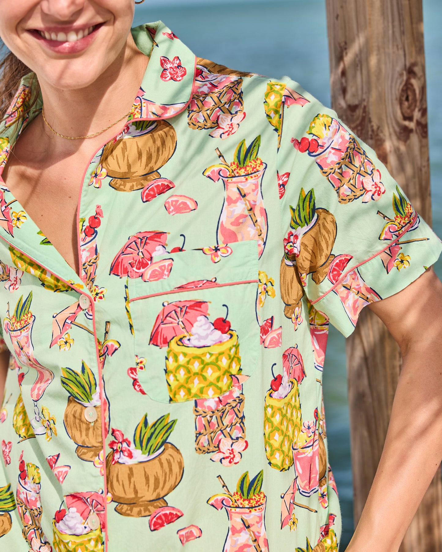 Close-up of the Mojito pajama top showing the notched collar, piping, buttons, and chest pocket