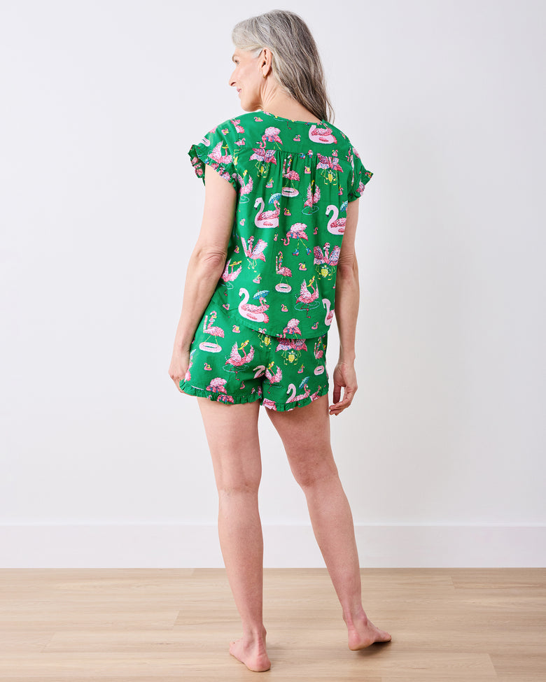 Back view of the green flamingo-print pintuck top and matching ruffled shorts