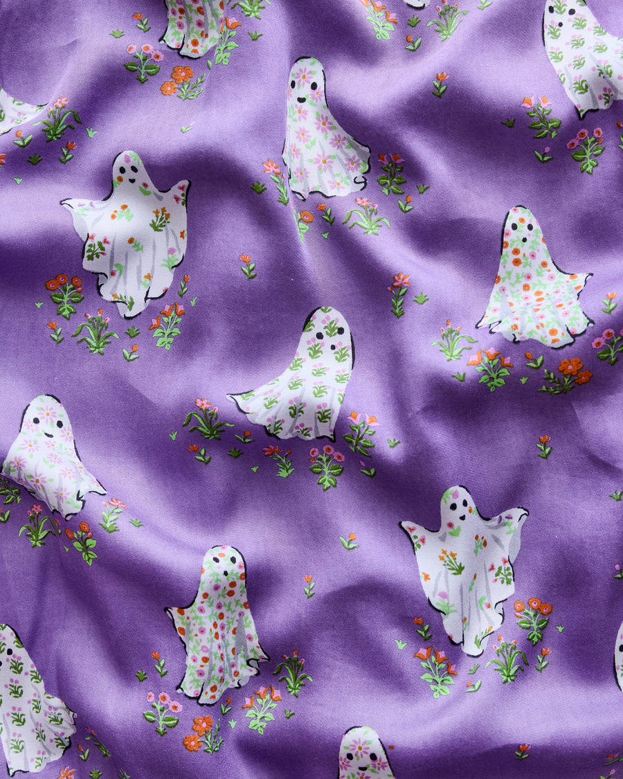 Repeating print of white floral-patterned ghosts surrounded by small flowers for the Gardening Ghosts petite pajama set.