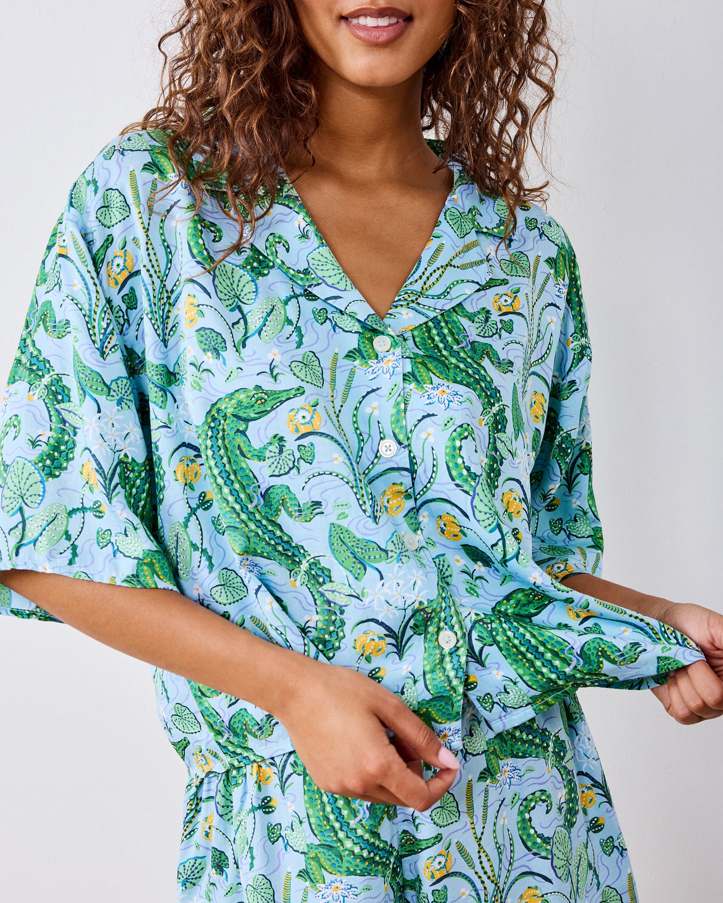 Front close-up of the Blue Lagoon pajama top with the hem held outward