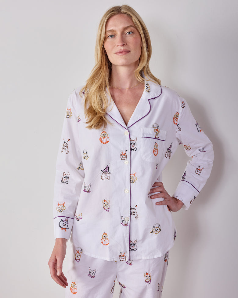 Front close-up of the Cloud Halloween Hounds long pajama set, showing the notched collar, chest pocket, buttons, and dog-face costume print.