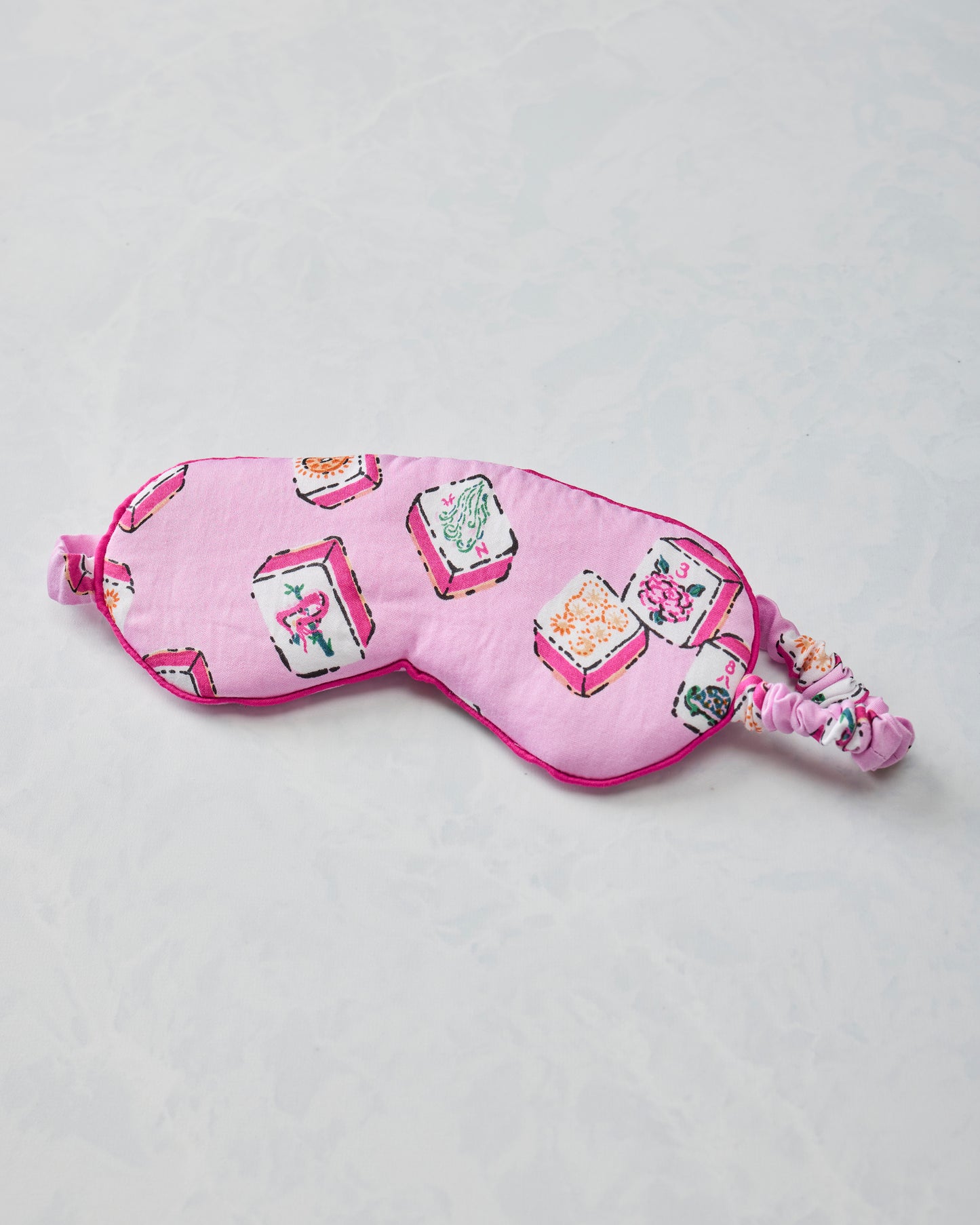Peony pink eye mask with Lucky Tiles print and gathered adjustable strap
