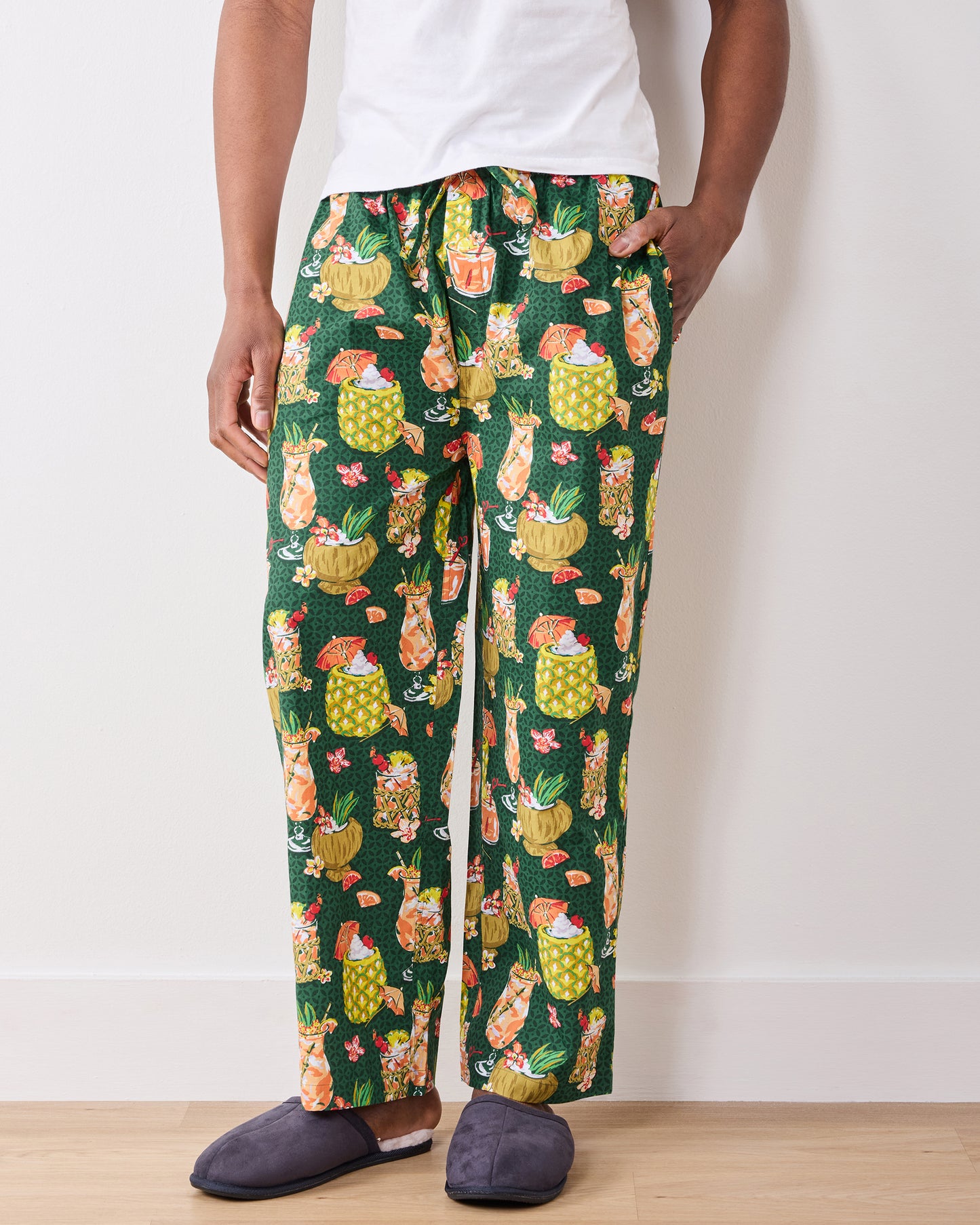 Front view of green Paradise Punch pajama pants showing the straight legs and tropical drink print