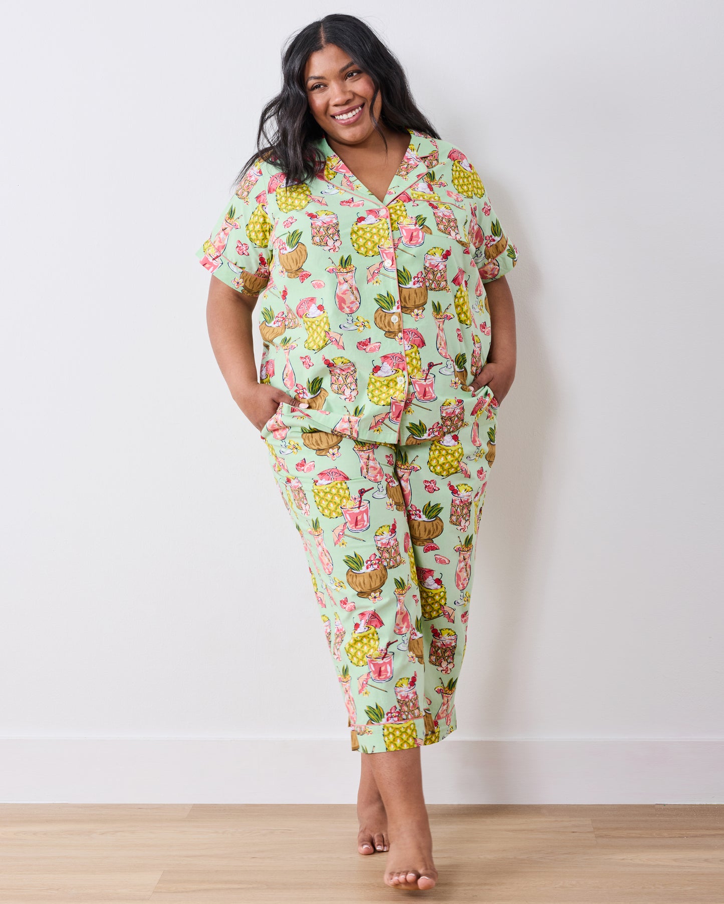 Front view of the Mojito short-sleeve button-down top and cropped pants set with tropical drink print