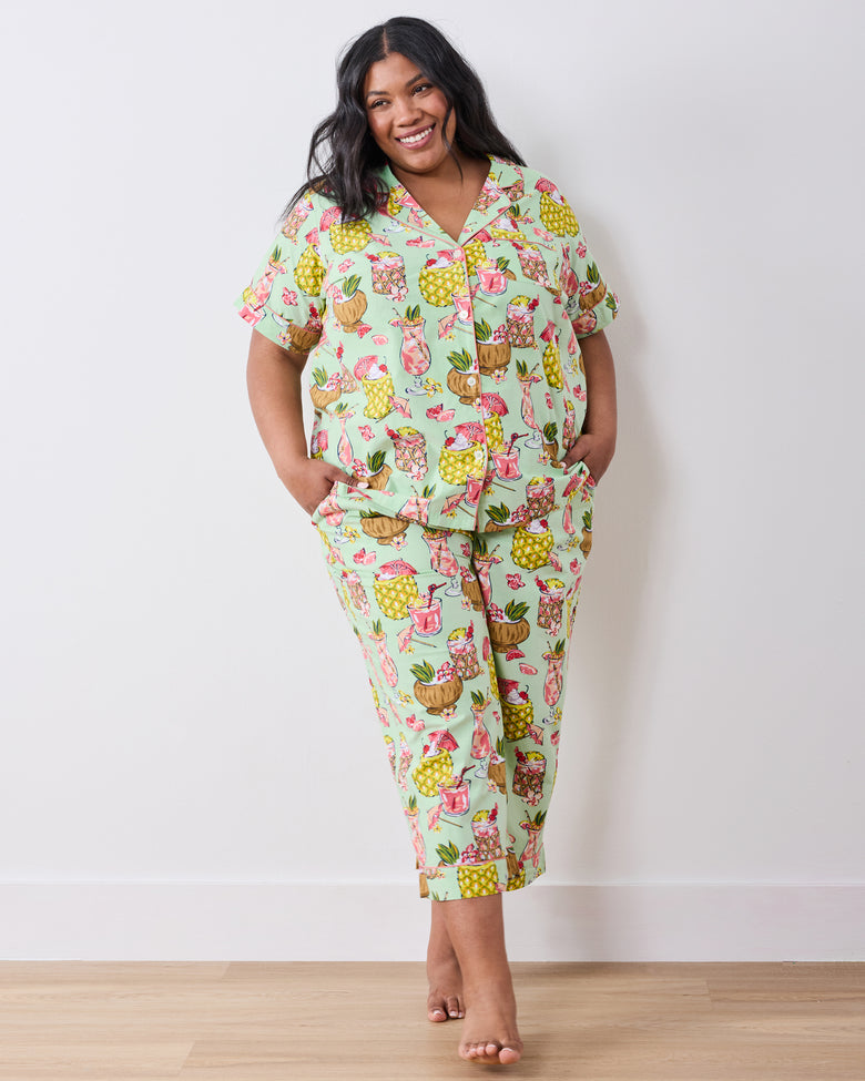 Front view of the Mojito short-sleeve button-down top and cropped pants set with tropical drink print