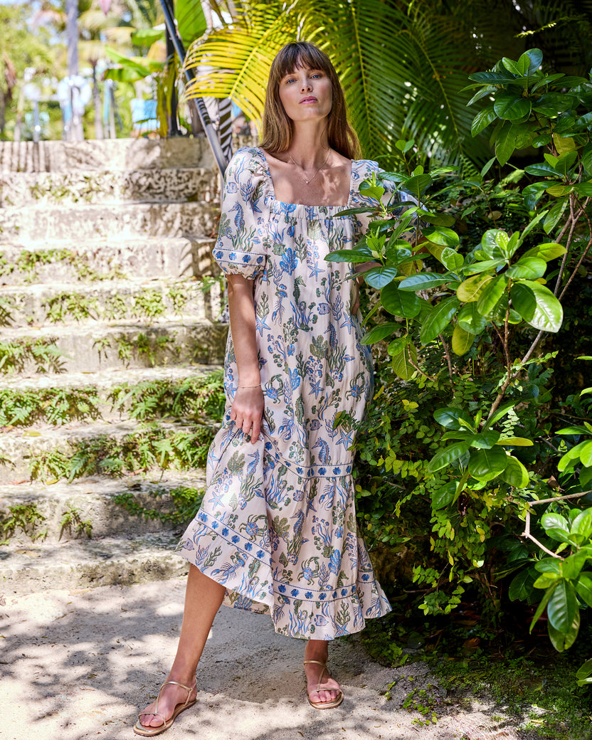 Full front view of the Saltwater Serenity Collins Dress with a square neckline, puff sleeves, and tiered long skirt