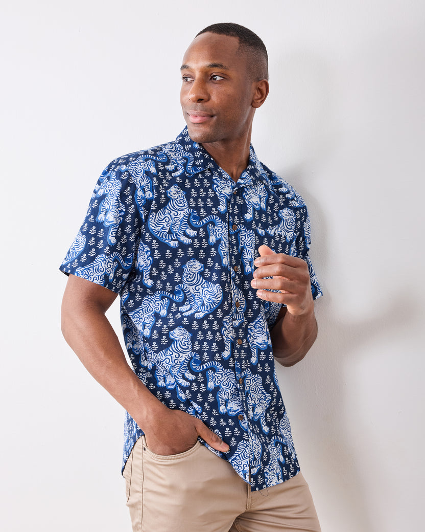 Front view of the indigo short-sleeve button-down shirt with white and blue tiger print.