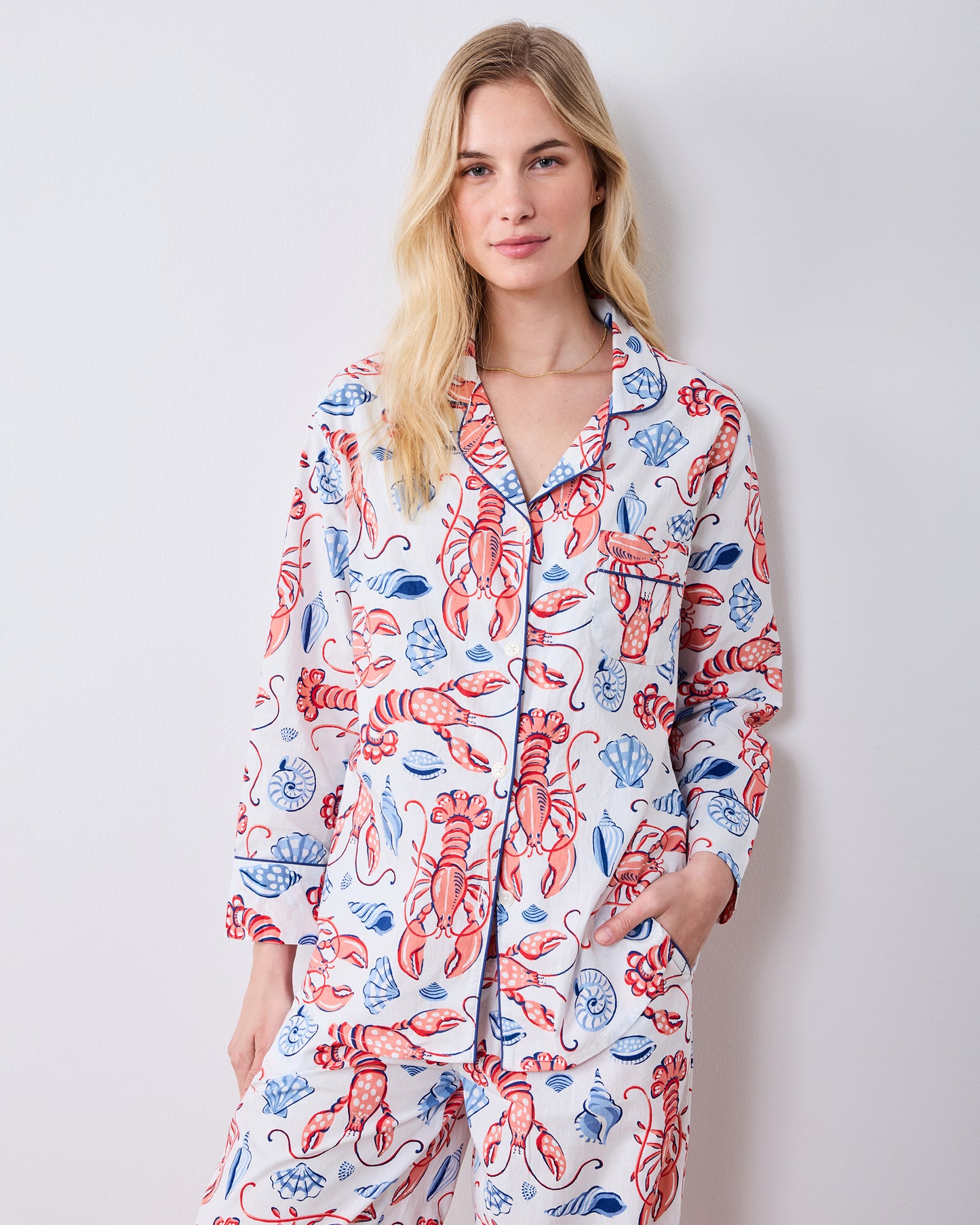 Front three-quarter view of the long pajama set with lobster and seashell print