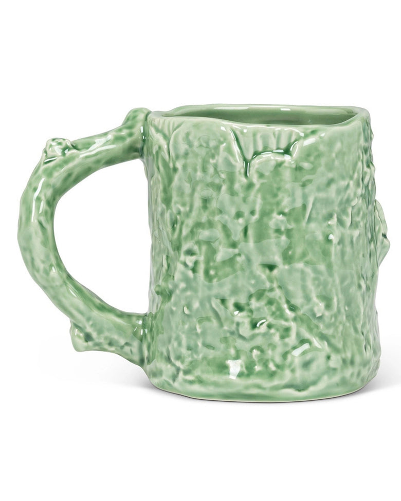 Rear view of the green mug, showing its textured back and handle on the left.