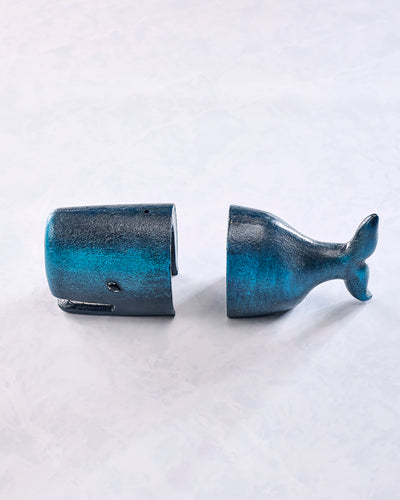 Two gray whale-shaped bookends shown separately from the side, with one whale facing left and the other facing right.