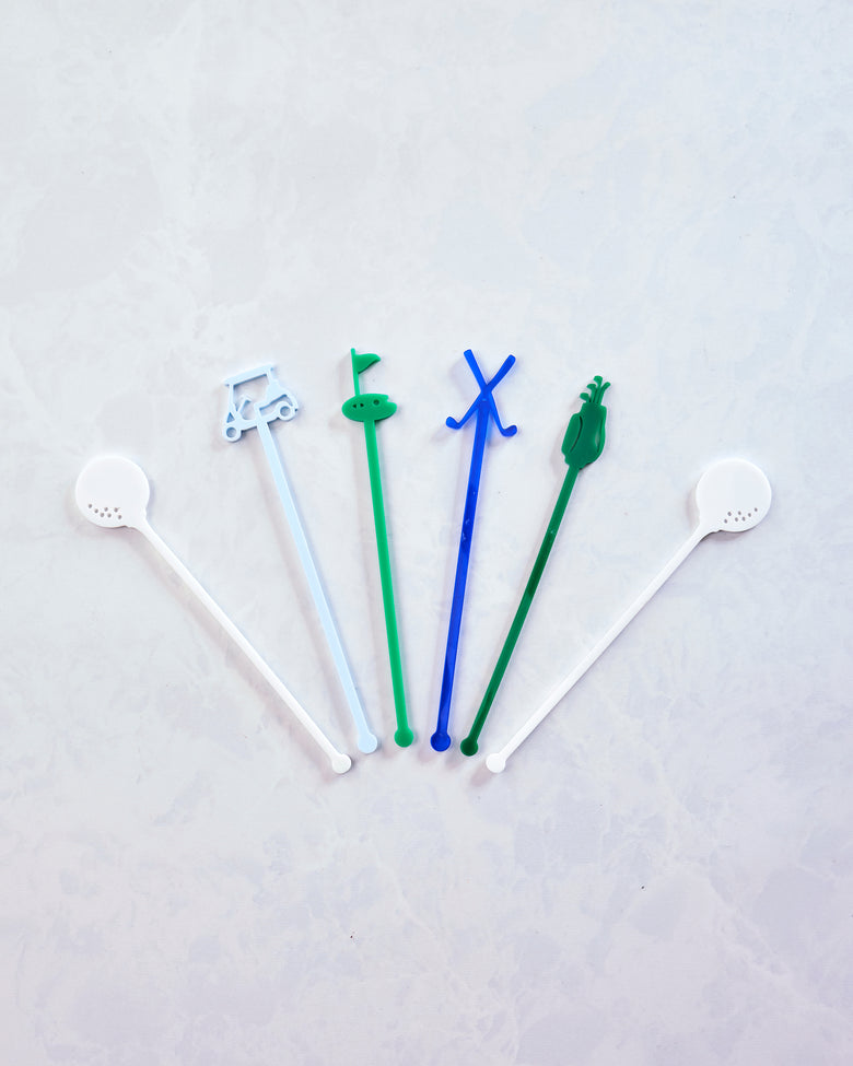 Five colorful golf-themed stir sticks arranged in a fan shape on a light background.
