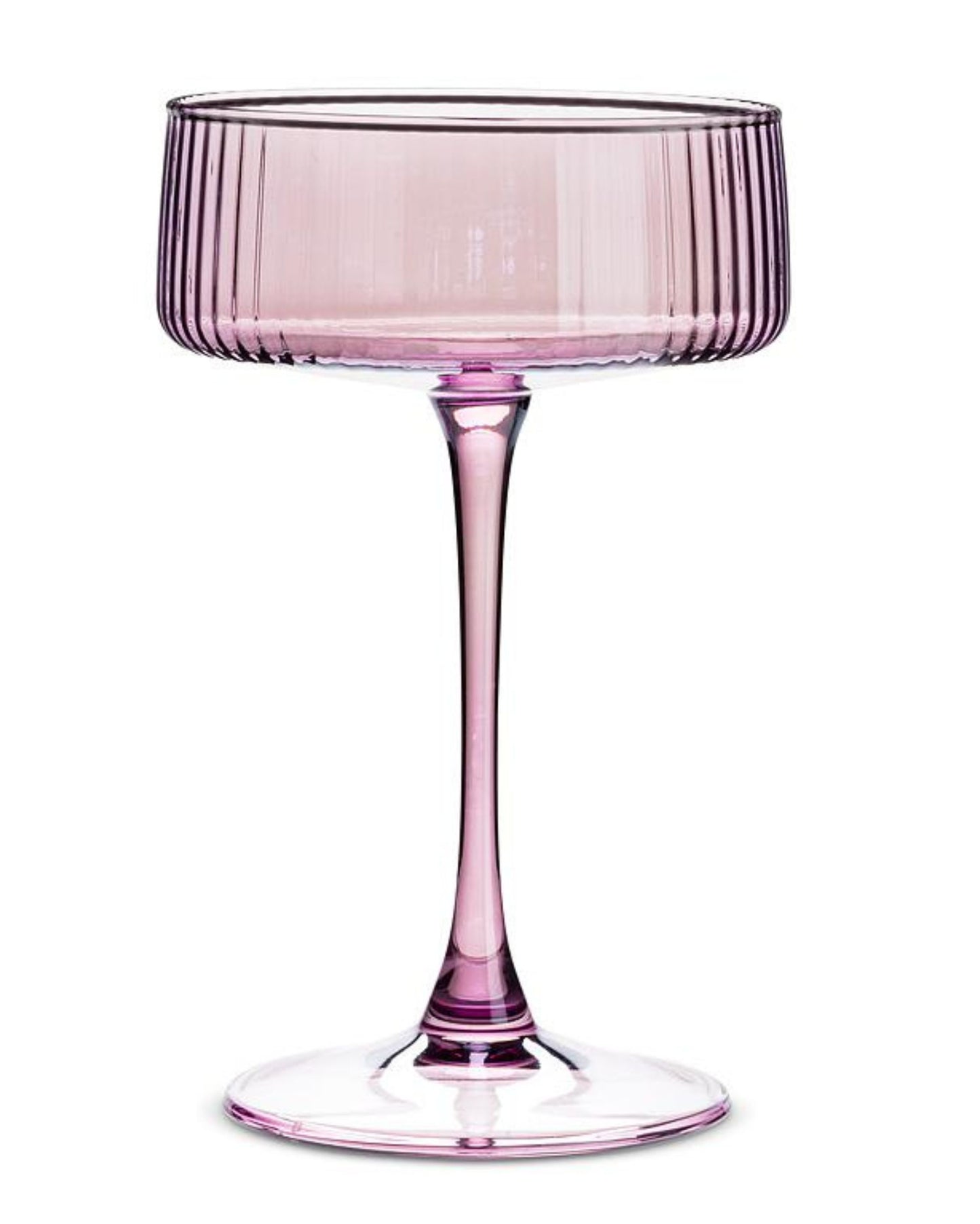 Single pink ribbed cocktail coupe glass with a long stem and round base.
