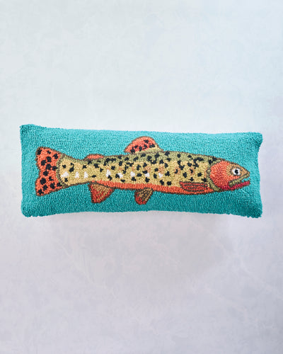 Front view of a lumbar pillow with a spotted trout on a turquoise background.