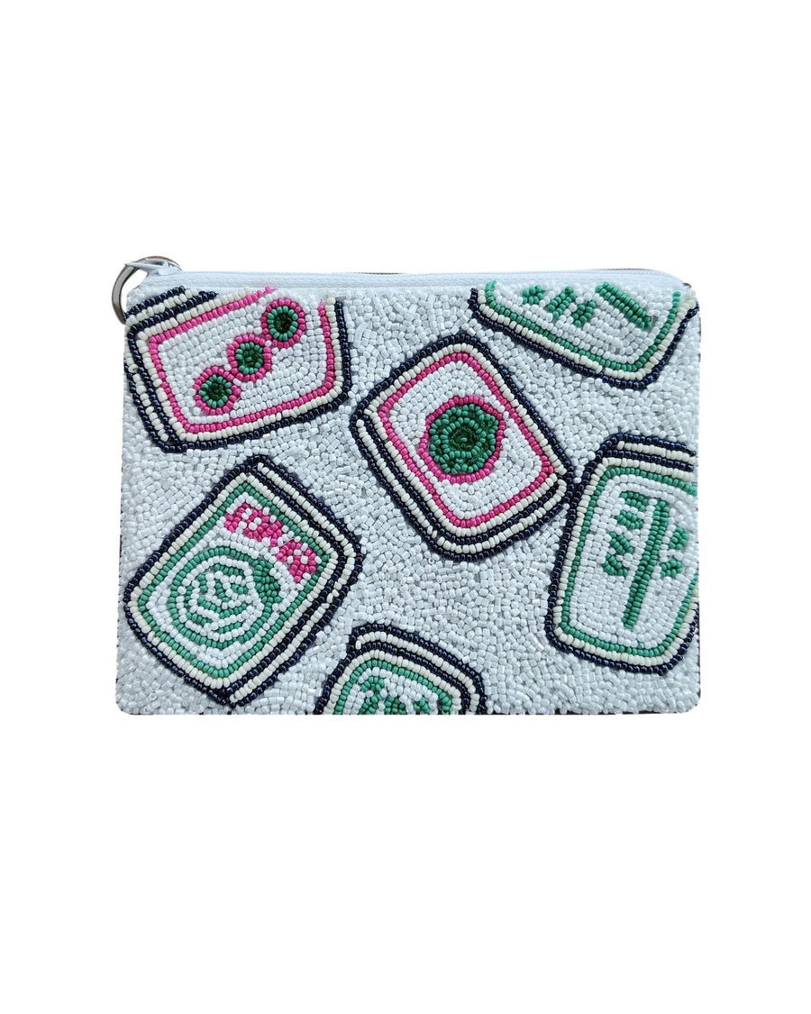 White beaded coin purse with outlined square motifs and green-and-pink circular details.