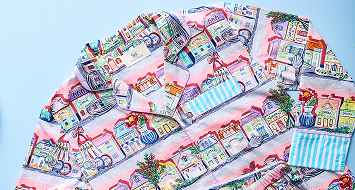 Colorful illustrated button-up shirt from the Lenox Spice Village collection.